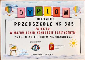 Na zdjęciu widać dyplom w ramce z kolorowym napisem „DYPLOM”. Dotyczy on udziału przedszkola w konkursie plastycznym.